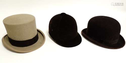 An early 20th Century grey top hat, together with a bowler and riding hat (3)