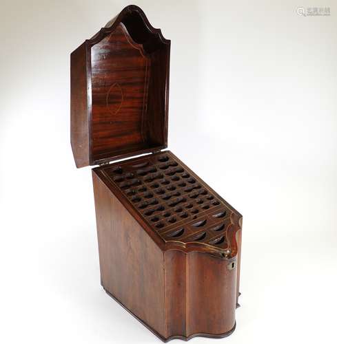 A late 19th or early 20th Century serpentine mahogany knife box, opening to reveal compartments