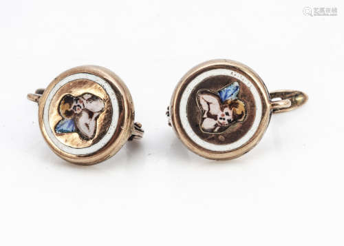 A pair of 19th Century gold and enamel circular earrings, centred with winged cherubs within a white