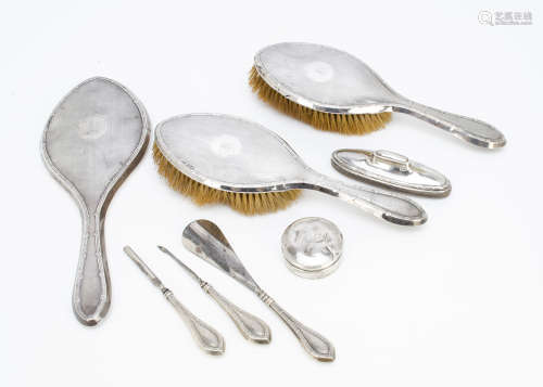 An Art Deco period silver dressing table set, with pair of hair brushes, hand mirror, together