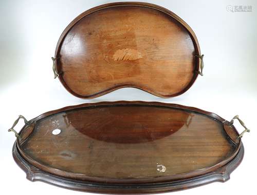 A late 19th or early 20th Century kidney shaped twin handled tray with central shell motif, 57cm x