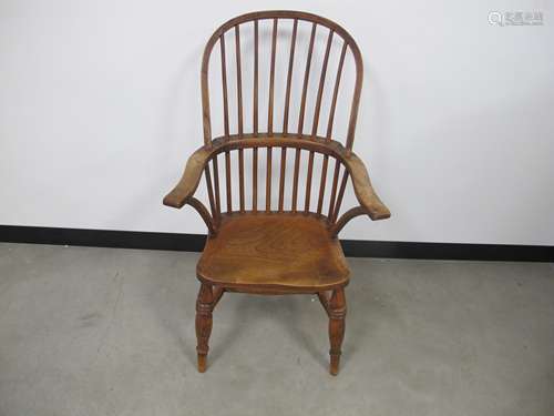 An antique Windsor chair, some cracks