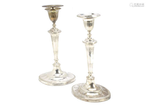 A pair of late Victorian silver filled candlesticks by Thomas Bradbury, AF, Regency style with