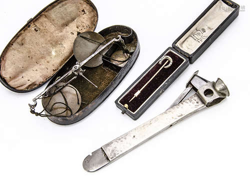 An Art Deco period continental silver handled cigar cutter, together with a 15ct gold marked stick