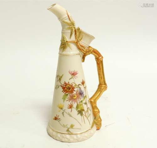 A Royal Worcester blush ivory porcelain ewer, the handle naturalistically moulded in the form of a