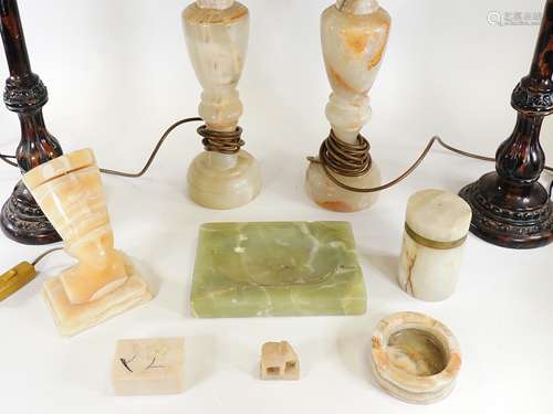 A pair of onyx lamp bases, height 54cm, one a/f, together with two tasselled shades, a pair of