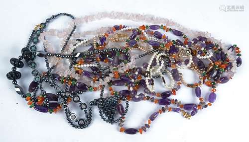 A quantity of costume jewellery, to include hardstone and seed pearl necklaces, a bulbous hematite