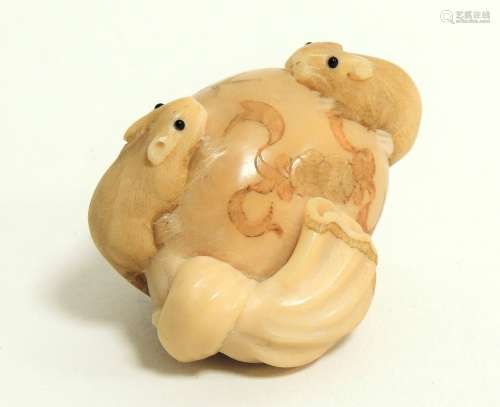 A Japanese Meiji period (1868-1912) or early Taisho (1912 - 1926) ivory netsuke in the form of