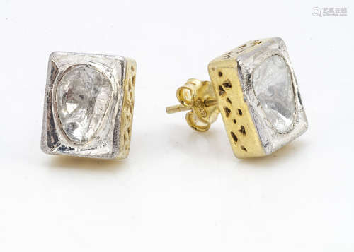 A pair of silver gilt and diamond slither stud earrings, in rubbed over settings of rectangular