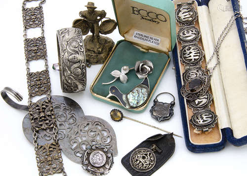 A collection of silver and costume jewels, including a Middle Eastern filigree bracelet, a silver