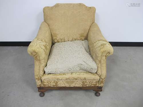 A low upholstered arm chair, stained beech frieze and cabriole front supports, loose drop in cushion