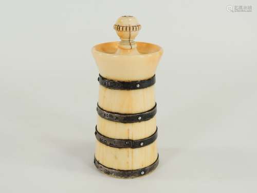 A c1900 ivory pepper mill mounted with silver, the four silver bands hallmarked for London, possibly