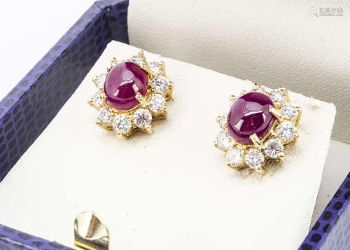 A pair of continental yellow metal ruby and diamond earrings, the cabochon rubies in four claw