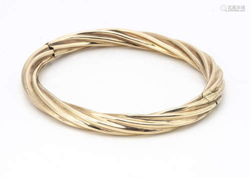 A 9ct gold rope twist hinged bangle, with hollow core, tongue and box clasp, marked to clasp 9k