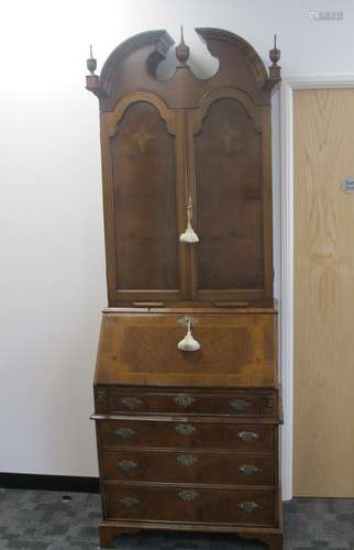 A continental style contemporary walnut bureau bookcase the top section having two panel doors