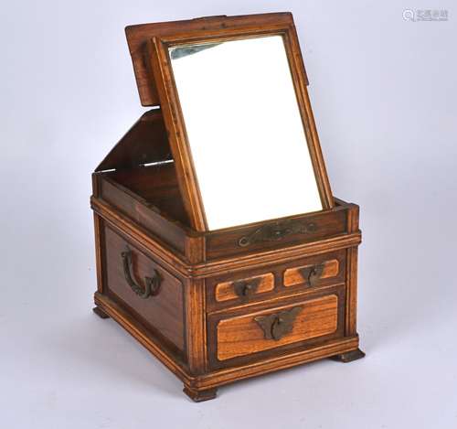 A 20th Century Chinese hardwood dressing table box, of rectangular form, the top lifting to reveal