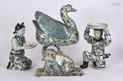 A 20th Century oriental blue and white figure of a duck, with decoration of bats, flowers and