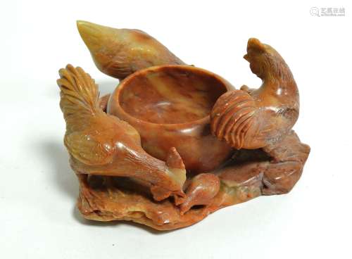 A Chinese soapstone water pot with encircling chicks and chickens, the motif of the cockerel