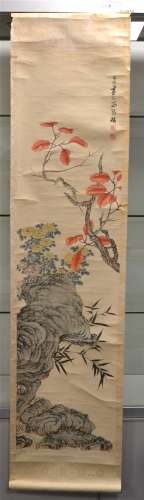 A Chinese 20th Century scroll painting, ink and colour on paper, depicting a songbird perching on