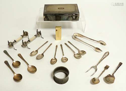 A pair of silver plated knife rests taking the form of gold balls and clubs, with central mother