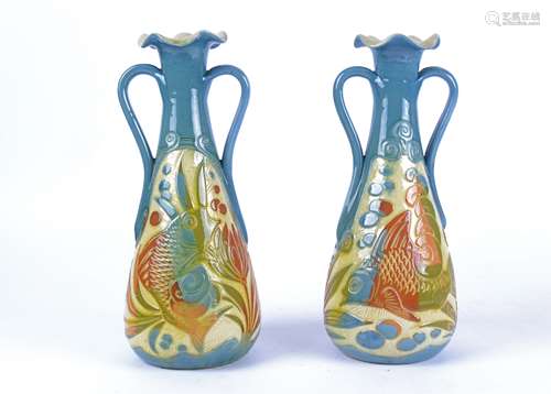 Alexander Lauder (1836-1921) a pair of Barum pottery twin handled Arts & Crafts vases, with stylised