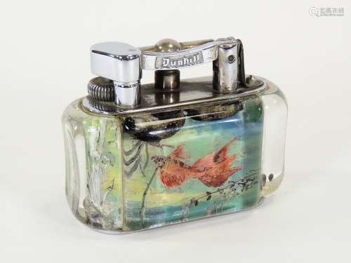 A Dunhill chrome plated and Lucite aquarium table lighter, one side with angel fish, the other