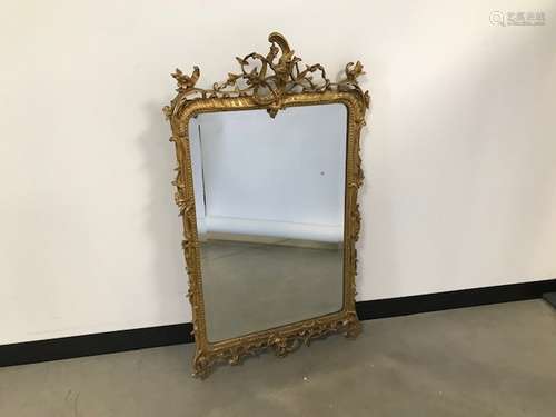 A modern rococo style gilt wall mirror, 117cm x 68cm