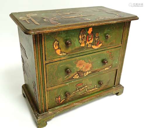 A Japanese small collectors cabinet, or chest of drawers, with three long drawers, raised on bun