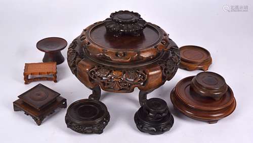 Three boxes with Chinese hardwood and other assorted wooden stands, to include one example on five