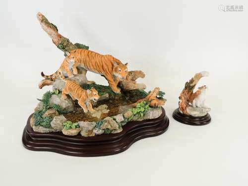A Royal Doulton sculpture of a prowling tiger and tiger cubs near water, 42cm x 34cm x 25cm,