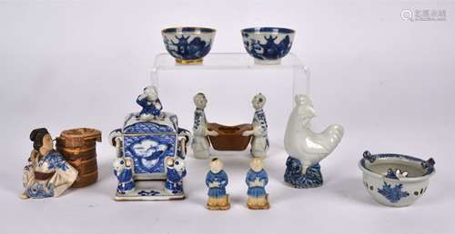 A Chinese porcelain Cafe au lait glazed pot supported by two attendants, Kangxi mark to base(1662-