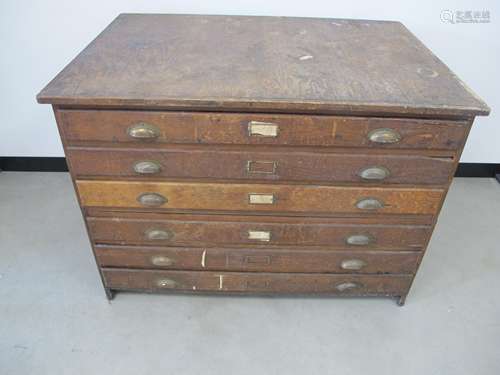 An 20th Century two section plan chest, oak frame with ply top and panelled sides, three oak front