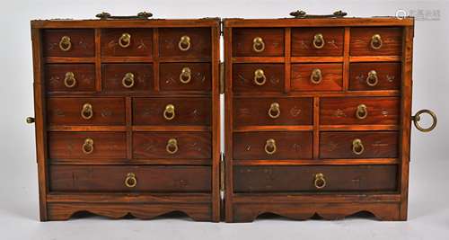 A Chinese yew wood medicine cabinet, opening to reveal two compartmentalised sides, each having