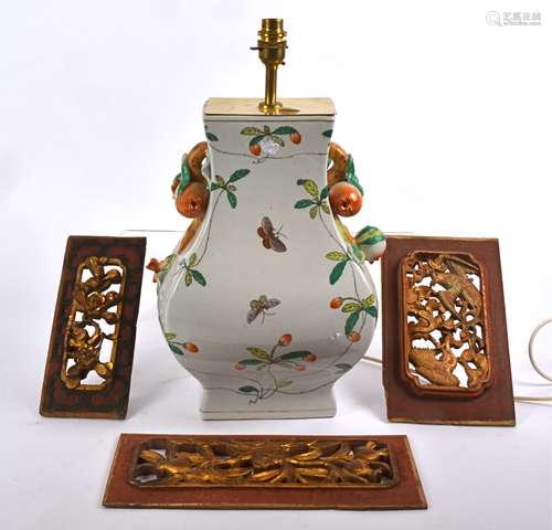 A contemporary Asian lamp base, decorated with butterflies and foliage upon a white ground, the