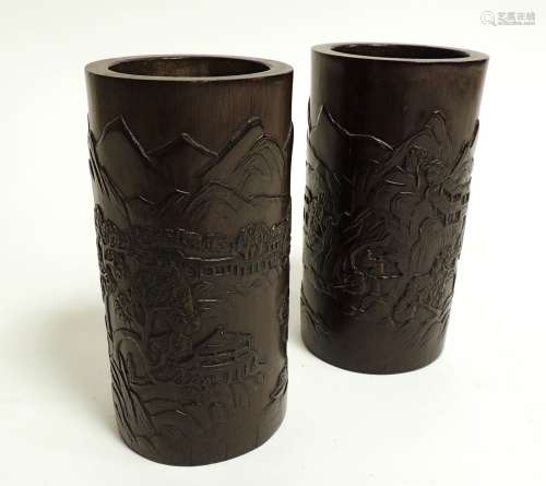 A pair of 20th Century bamboo brush pots, with original retailer's receipt inside, of cylindrical