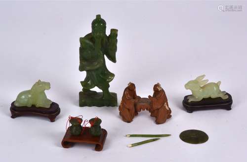 A small group of Chinese nephrite and bowenite figures, to include a figure of an Immortal holding a