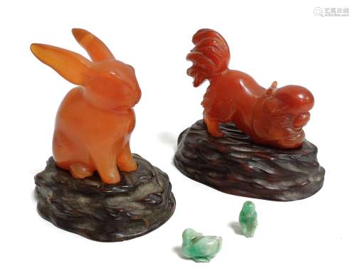 A Chinese Jadeite carving of a rabbit, height 6cm, together with a jadeite Pekinese dog playing with