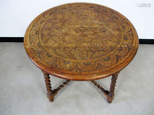 A James Schoolbred early 20th Century oak occasional table, circular top and shape frieze carved