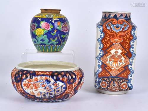 A 20th Century Imari decorated vase with alternating panels of baskets of flowers and formal