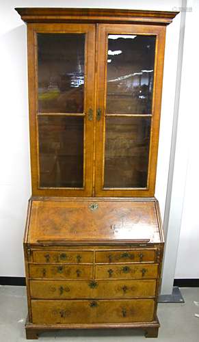 A George II figured walnut bureau bookcase, upper section with moulded cornice, two glass panelled