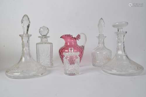 Four glass decanters, together with a cranberry glass jug and lidded pot (6)