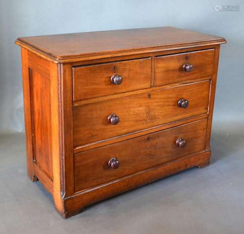 A Victorian Mahogany Chest, the moulded top above two short and two long drawers with knob