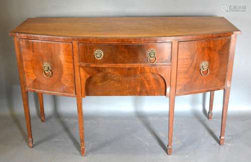 A Early 20th Century Mahogany Bow-Fronted Sideboard with two central drawers flanked by cupboard