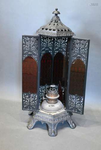 A Wrought Iron Heater of pierced form with side handles, 86 cms tall