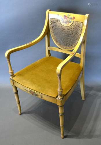 A Regency Painted Armchair, the partly caned back above a similar seat raised upon ring turned