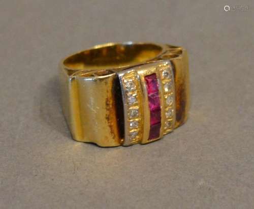 A Yellow Metal Cocktail Ring set with a band of rubies flanked by diamonds