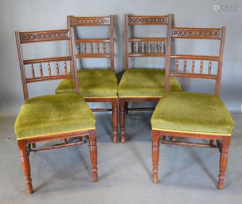 A Set of Four Late Victorian Walnut Dining Chairs by James Shoolbred each with a carved bar and