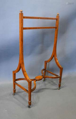 An Edwardian Sheraton Revival Valet Stand with twin end supports and shaped stretcher with brass