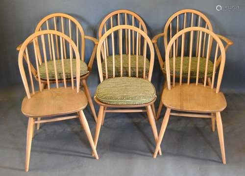 A Set of Six Ercol Blonde Ash Stick Back Dining Chairs comprising two arms and four singles with