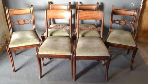 A Set of Four William IV Mahogany Dining Chairs each with a pierced rail back above drop in seat